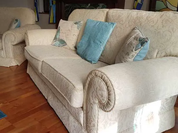A cosy lounge with cream sofas