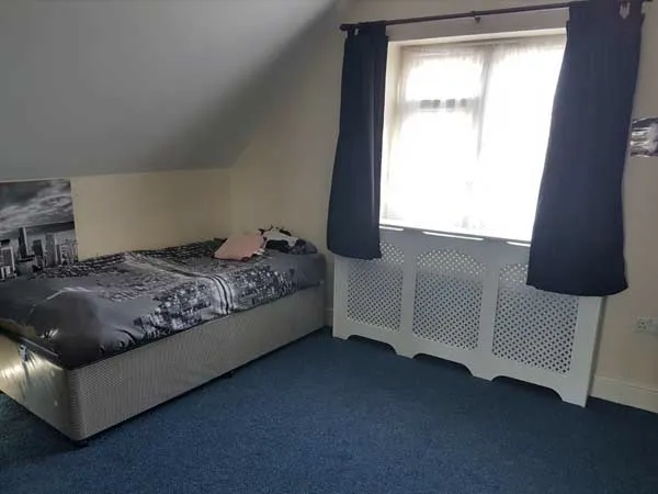 A calm bedroom at Robinson House